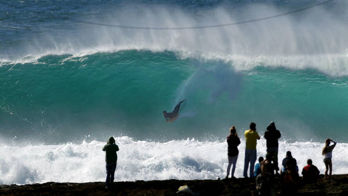 Huge swell hits the coast, including Cowries in Shellharbour. Picture: ANDY ZAKELI