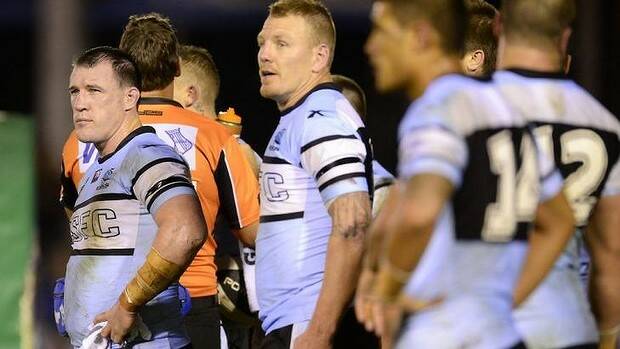 Cronulla skipper Paul Gallen looks dejected while standing with teammates in the in-goal area watching a Manly conversion at Remondis Stadium on Saturday night. Picture: GETTY IMAGES