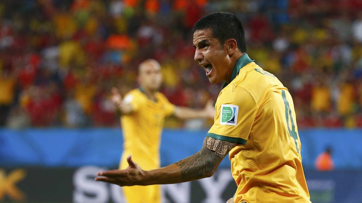 Tim Cahill protests against his disallowed goal. Picture: REUTERS