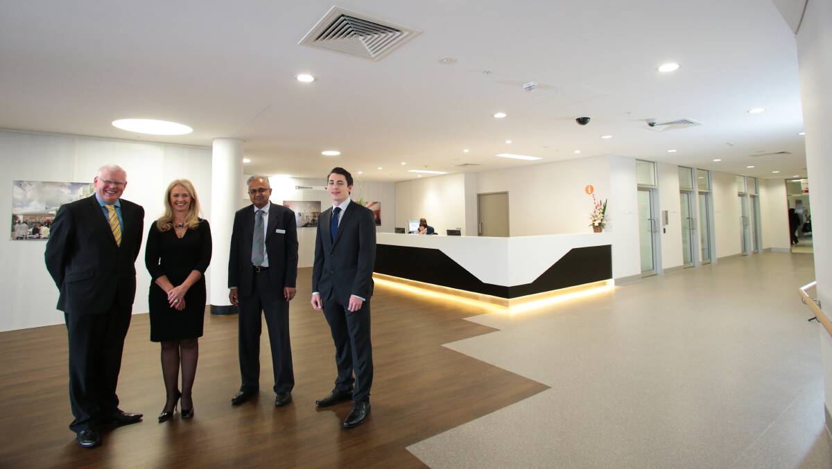 Kiama MP Gareth Ward, Wollongong Hospital’s Nicole Sheppard and Dr Raghu Murthy, and Liberal Party supporter Mark Jones inspect the foyer. Pictures: ADAM McLEAN