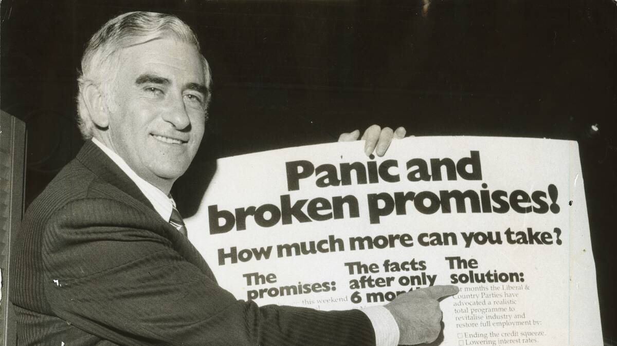 Bill Snedden holding the new Liberals advertisement in 1974.