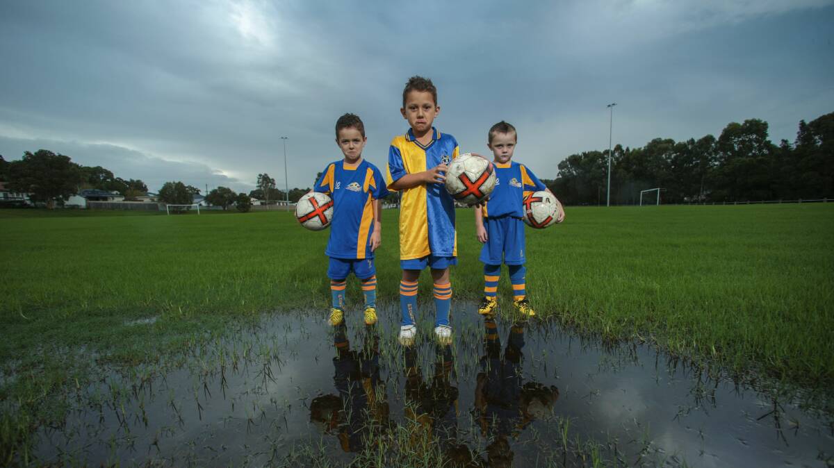 Dapto Junior FC under-7s Daniel, Cody and Finley are sad that they haven’t been able to play this season. Picture: ADAM McLEAN