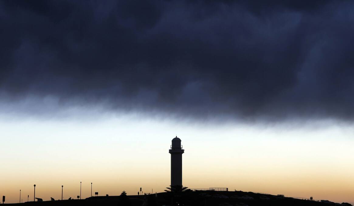 A heavy storm front over Wollongong Lighthouse on Wednesday. Picture: ANDY ZAKELI