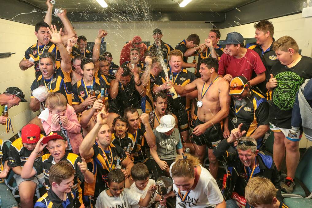 Nowra-Bomaderry players and supporters celebrate their victory. Picture: ADAM McLEAN