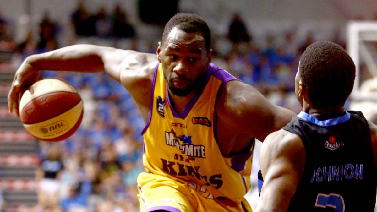 Sydney Kings’ Sam Young runs over NZ Breakers point guard Kerron Johnson. Picture: GETTY IMAGES