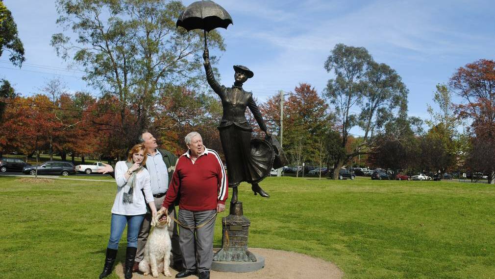 Melissa McShane, George, Terry Oakes-Ash and Paul McShane inspect the Mary Poppins statue. Picture: DOMINICA SANDA