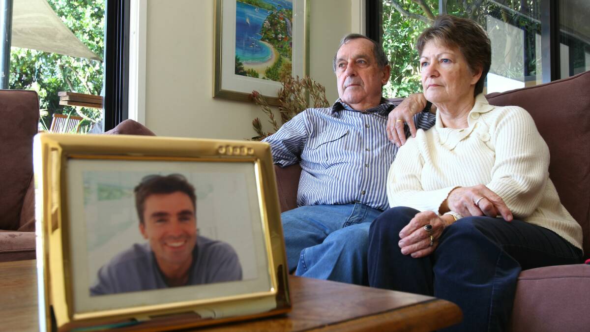 Robert and Rosalie Taylor with a picture of their son, Simon, who was murdered as he tried to sell a diamond ring in March, 2003.