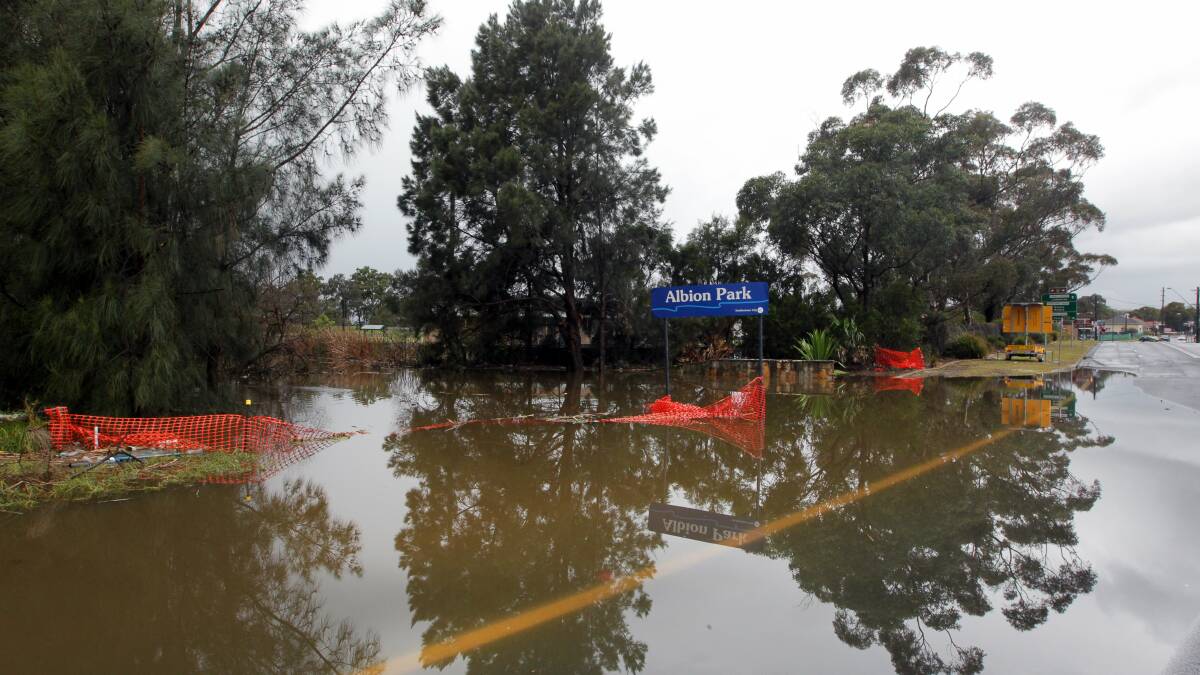 The flooded Illawarra Highway, Albion Park. Picture: SYLVIA LIBER 