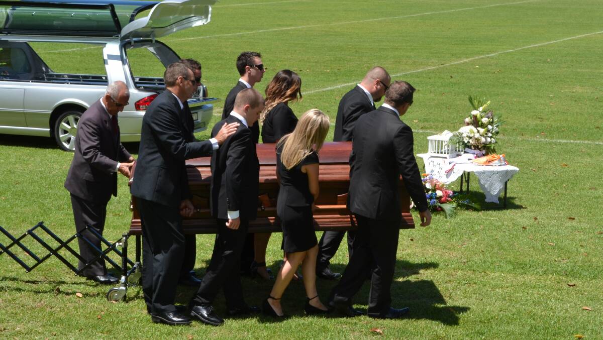 At the end of the service, Mr Rozs' casket was given a lap of honour around the showground.