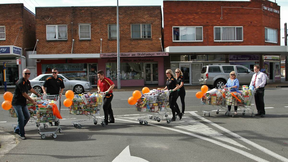Some of the 20 trolleys of food collected by Bendigo Bank and Woolworths at Fairy Meadow. Picture: GREG ELLIS