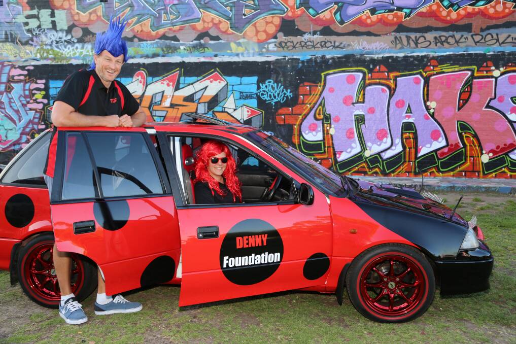 The DENNY Foundation ambassador Glenn Saville and director Lauren Purcell at McCabe Park in The Luv Bug during  public appearances this month. Picture: GREG ELLIS