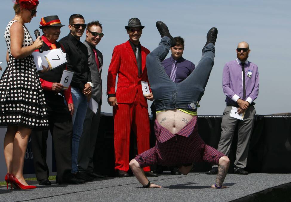Dale Jackson of Horsley breakdances during the mens' Fashions on the Field contest. Picture: ANDY ZAKELI