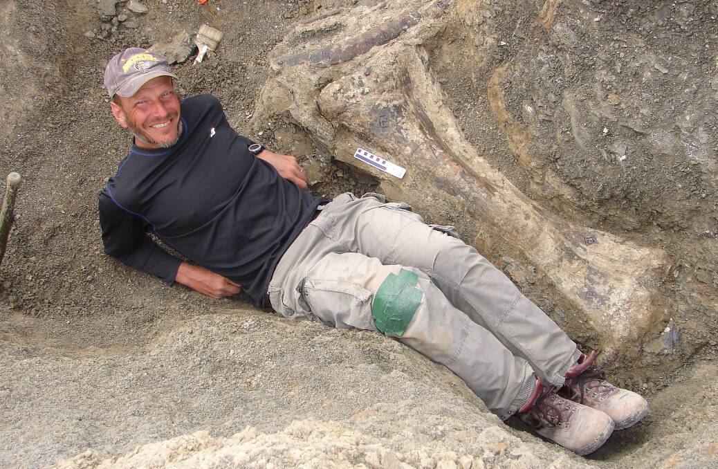 Kenneth Lacovara lying next to the  right tibia of Dreadnoughtus. Photo: KENNETH LACOVARA