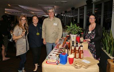 Jonni Nicolaou with Marie Smith, of Early Years Care, and Portors Produce stallsholders Craig Roy and Trish Roy at the Lagoon Seafood Restaurant night markets. Picture by Greg Ellis.
