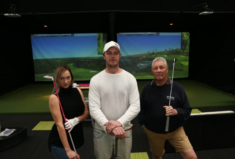 Stroke of fortune: Cassie, Sam and David Cahill at Par-Tee Virtual Golf in Albion Park Rail. Picture: GREG ELLIS
