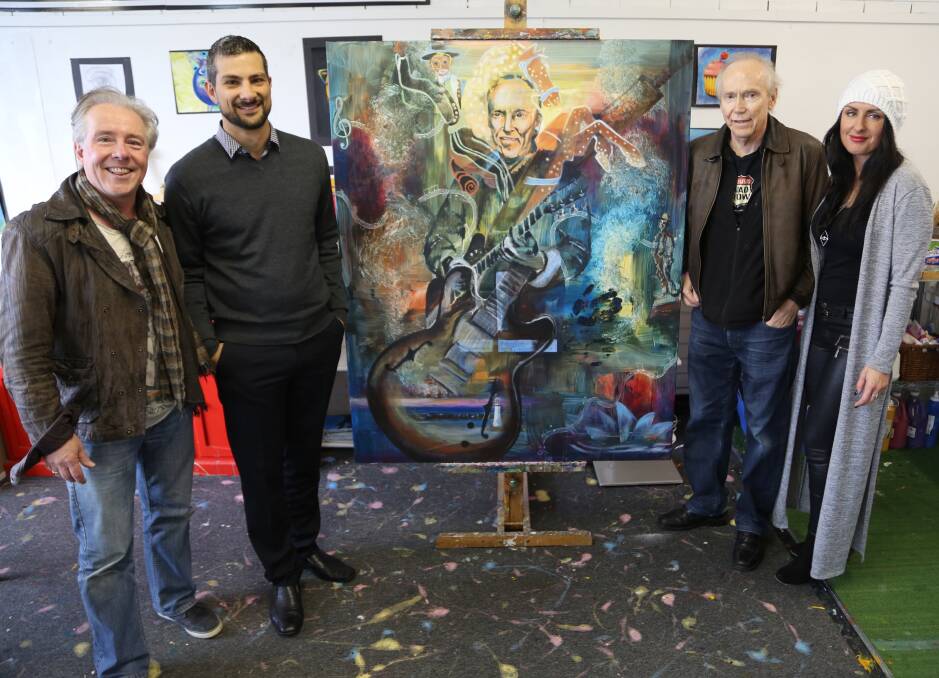 Scott Radburn, Andrew Harrison, Graham Wilson and Natalija Vocanec during the creation of a major artwork inspired by Wilson, a member of the Four Kinsmen, and his life. It has changed since this image was taken last week and now has ferris wheels to represent State Fairs and the Four Kinsmen performing. Picture by Greg Ellis. Artwork by Natalija Vocanec, of Little Leonardo's Art Studio and Design by Natalija.
