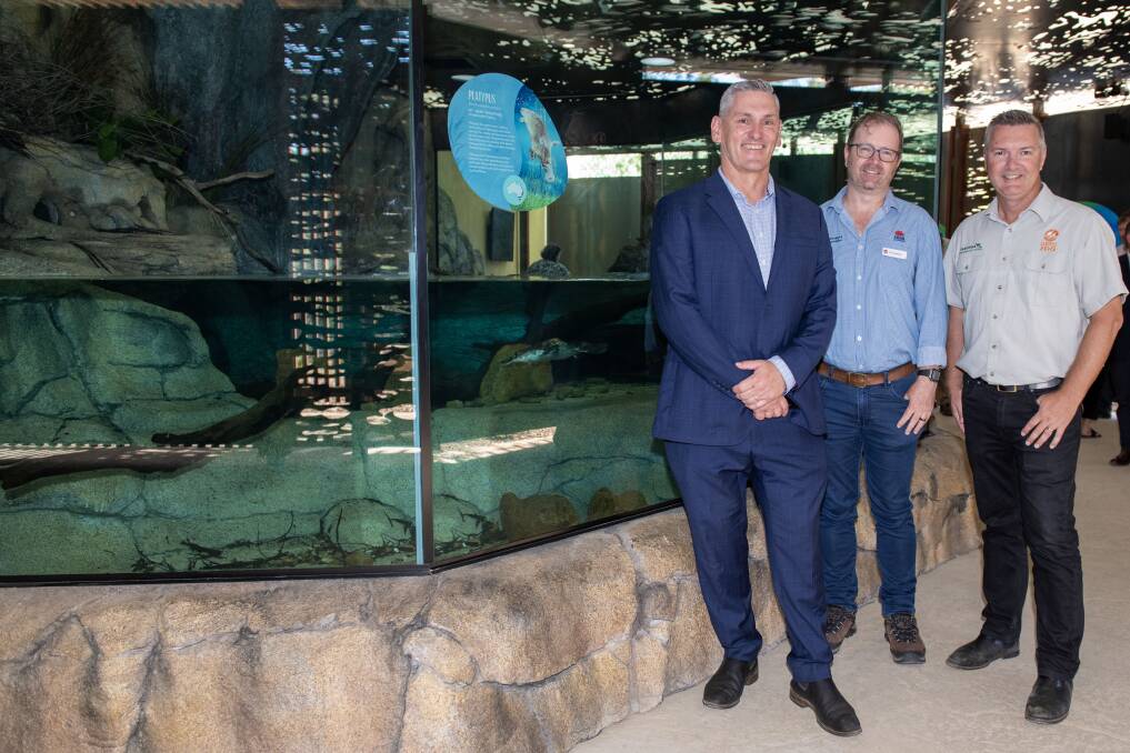 Murray Wood, Tim Hosking and Steve Hinks with Mackenzie the platypus. Picture by Belinda Soole
