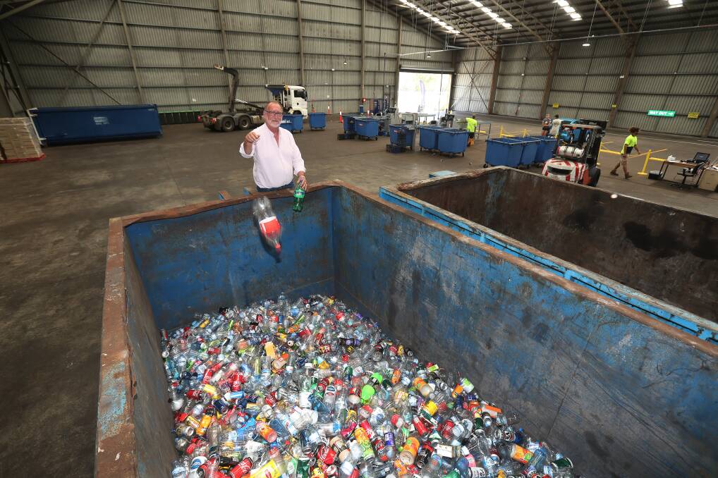 Plastic fantastic for funds for families: Peter Quarmby at the Vinnies Bulk Container Deposit Centre at Unanderra which has been doing a roaring trade over Christmas/New Year period. Picture: Robert Peet.
