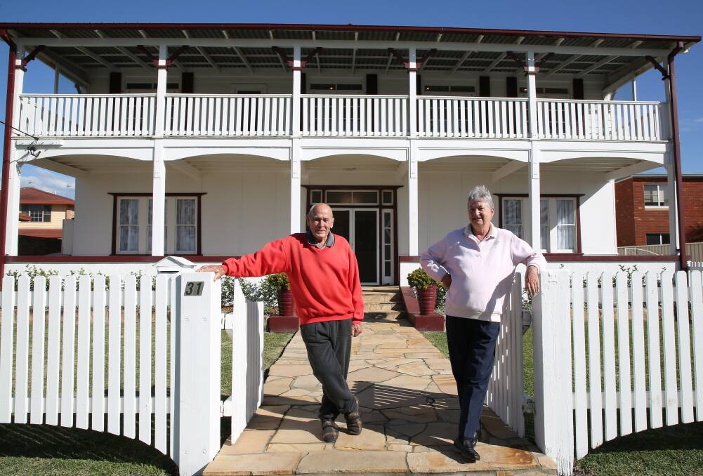 History for sale: Charlie and Lauris Kentwell in front The California Manor at Reddall Parade, Lake Illawarra affectionately known as the Lake House. Picture: Greg Ellis.

