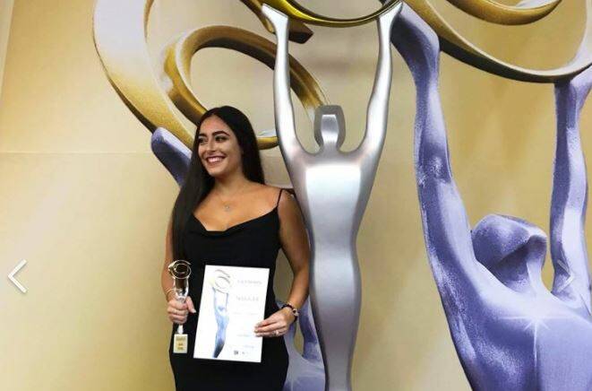 Shellharbour small business winner: Nicola Xanthopoulos, 23, of Nicola's Tutoring, with her national Sole Trader Champion Award at the Australian Small Business Champion Awards.

. 