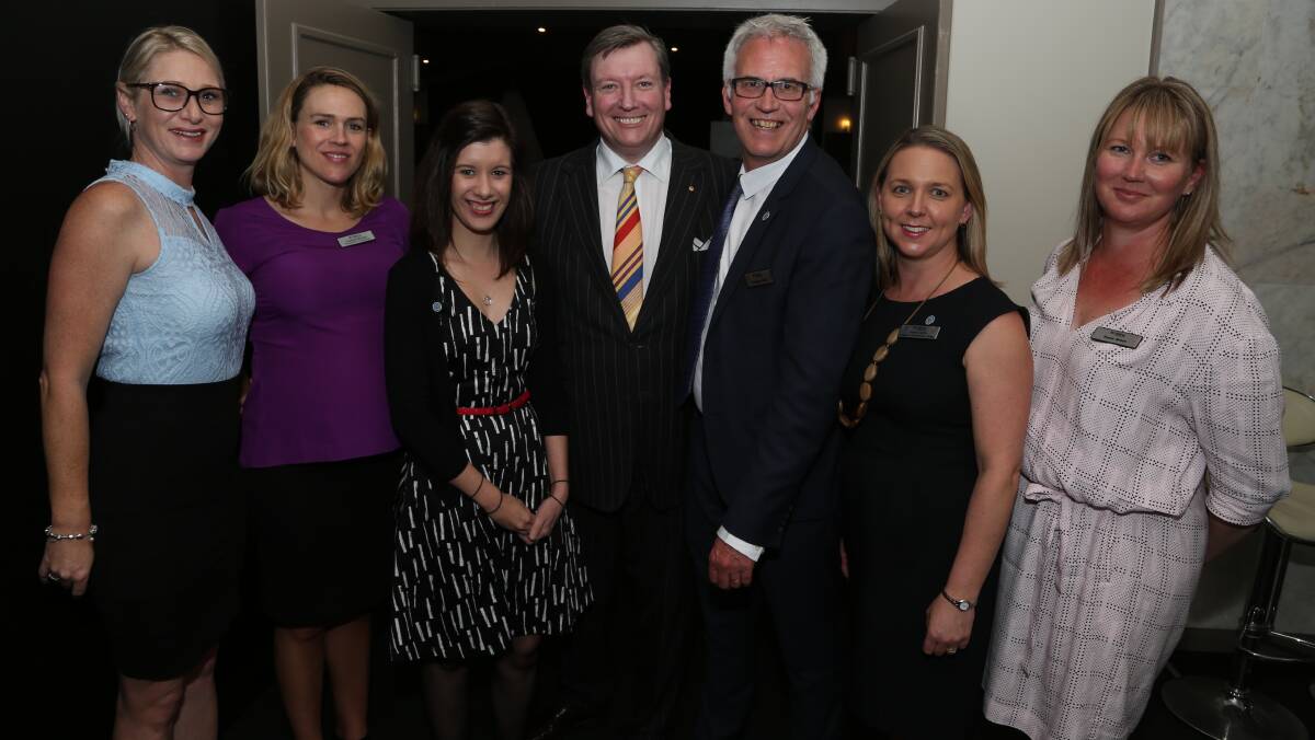 Lifeline team: John Brogden and Grahame Gould (centre) with some of the team from Lifeline South Coast. Picture: Greg Ellis.
