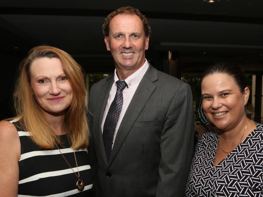 Networking returns: Robyn Ackroyd with IMB Bank's Terry Widdicombe and Tania Kimmins. Pictures: Greg Ellis.
