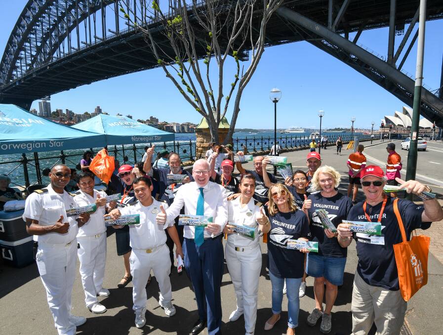 Welcome: Destination Wollongong/IRT volunteer ambassadors at Circular Quay handing out information to Norwegian Star passengers and crew with Parliamentary Secretary for the Illawarra Gareth Ward. Picture: Peter Rae


