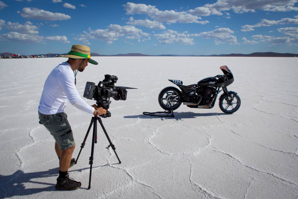 Film maker: Edgard Ferreira setting up to film a Harley Davidson land speed record on a salt lake.
