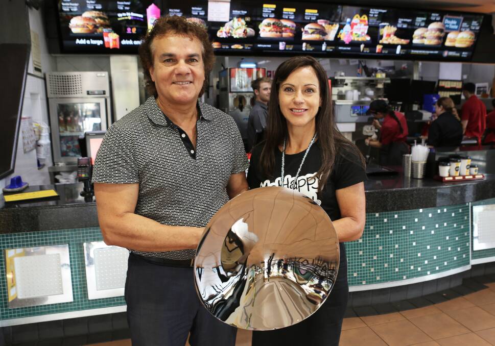 Best in the nation: Glenn and Katia Dwarte at McDonald's Warrawong with the inaugural McDonald's Australia Way Forward Award. Picture: Greg Ellis.
