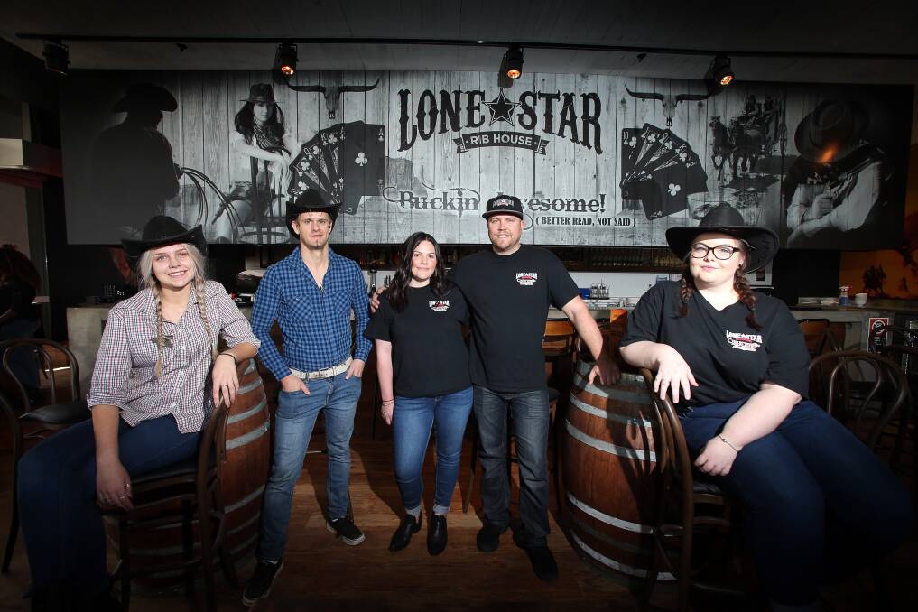 \Brittany Shepherd, Andrew Campbell, Ashley Carmichael, Mark Brown and Hayley Todd at the new Lone Star restaurant at Stockland Shellharbour's new The Avenue dining precinct. Picture: Sylvia Liber.

