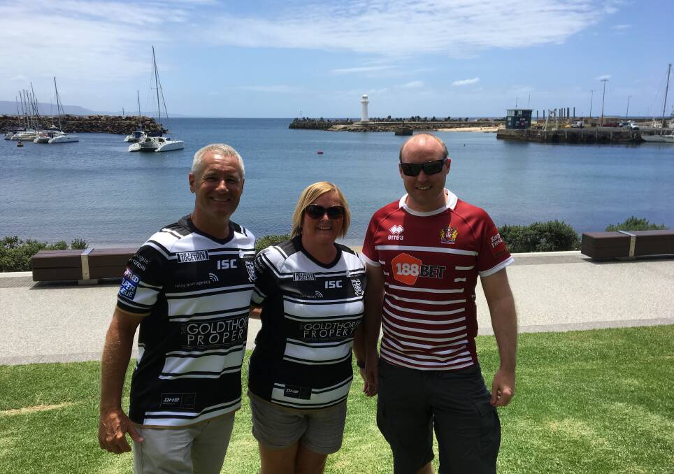 Ideal location: Hull supporters Ian and Julie Harper and Wigan fan Paul Botlon love Wollongong's warm, sunny and picturesque seaside location.


