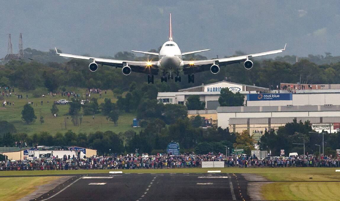 End of an era: Qantas 747 the City of Canberra landing at Shellharbour Airport on March 8, 2015 was the only other time a Jumbo has come in low over Dapto. Picture: Mark Newsham. 