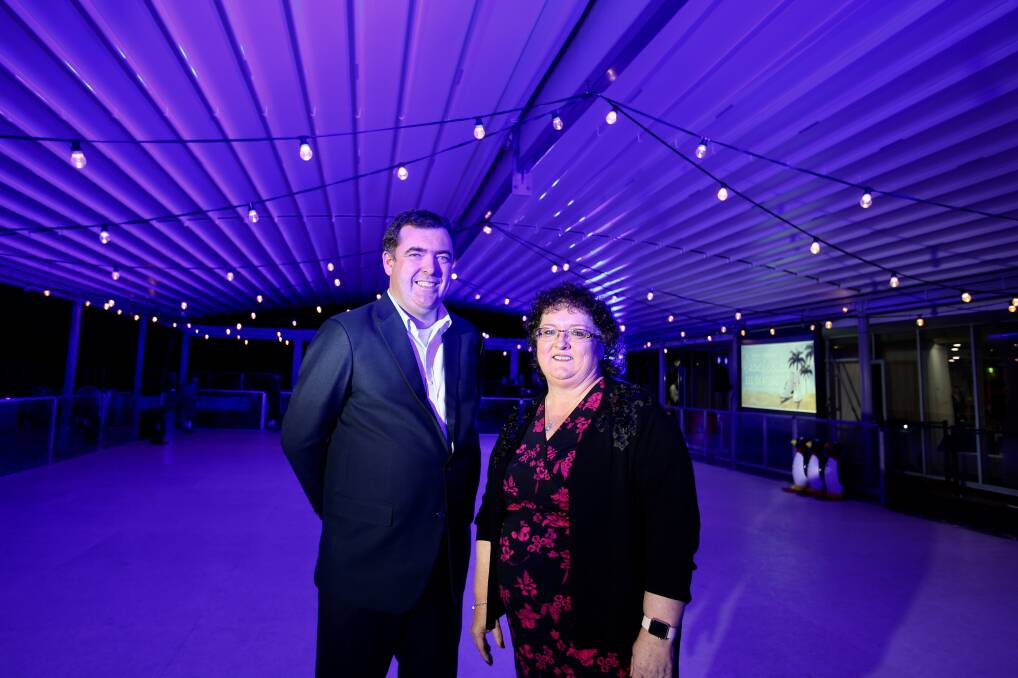 Eventsmean big tourism business: Destination Wollongong general manager Mark Sleigh and chair Tania Brown on the synthetic ice skating rink at the Novotel. Picture: Adam McLean.

