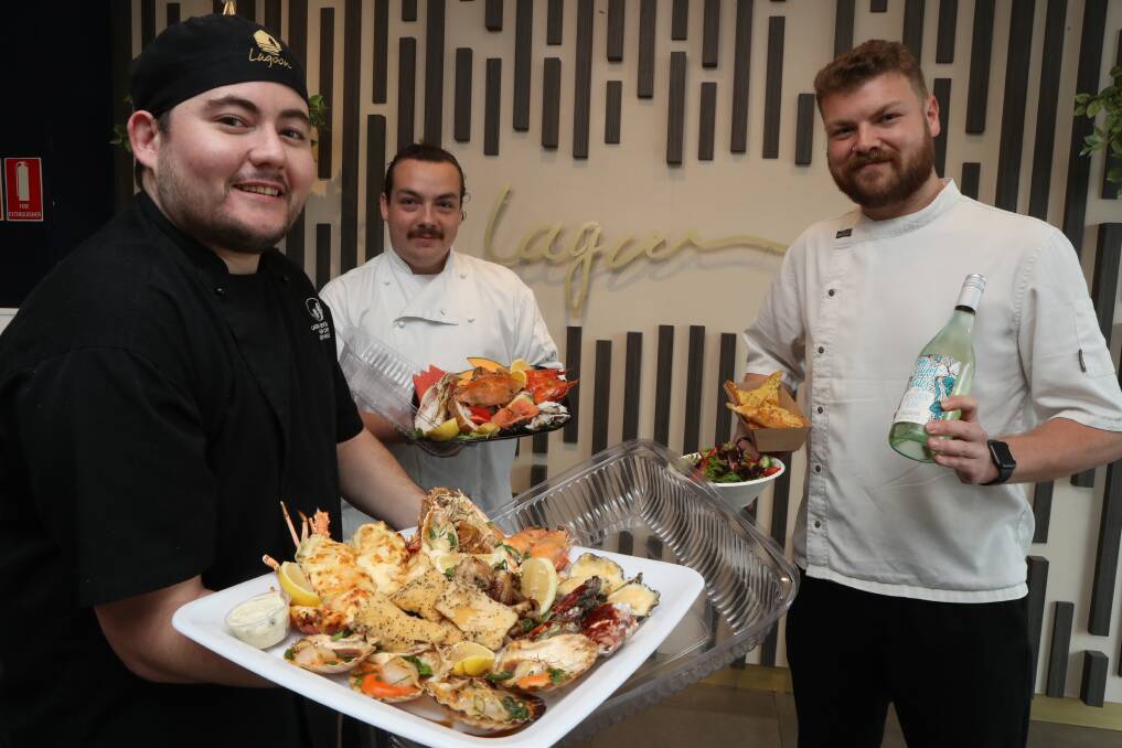 Say it with seafood: Lagoon Seafood Restaurant senior chefs Jason Hellyer, Matt Walker and Matt Lelli with one of the Mother's Day seafood platters. Picture: Robert Peet.
