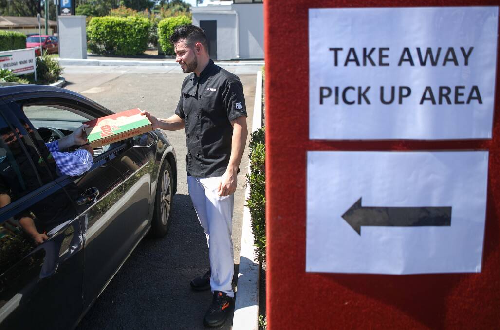 Drive-thru club: Pizza chef Claudio Russomanno at the Fraternity Club in Fairy Meadow as it introduces a drive-thru takeaway service. Picture: Adam McLean
