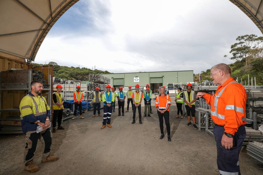 Trying Scaffolding for a Day: KJ Scaffolding's Work Health and Safety labour manager Kieran McGartland (right) speaking with potential trainees at KJ's scaffolding yard in Cringilla on Friday. Picture: Adam McLean.