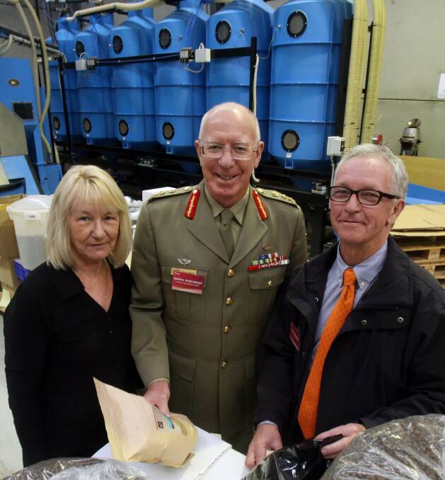Golden anniversary: Denise Hurley, General David Hurley and Roy Rogers during a tour of the Flagstaff Group's operations in Unanderra in 2013. Picture: Robert Peet.
