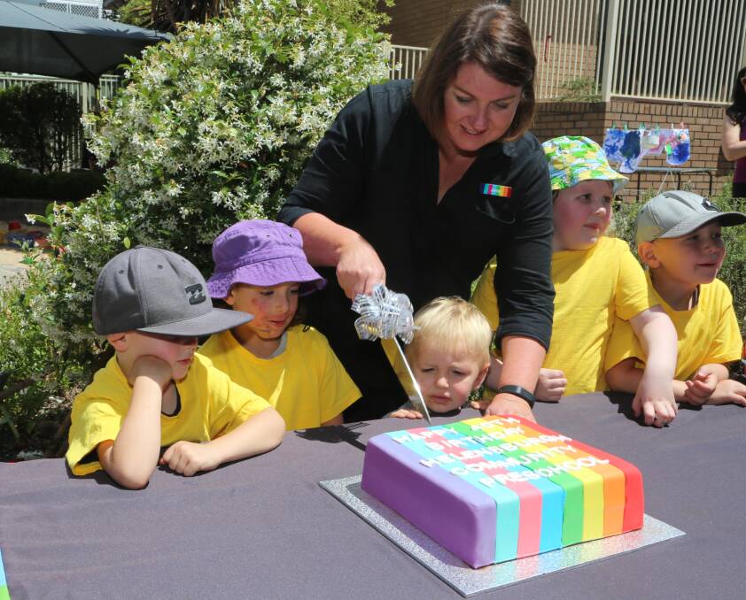 Big Fat Smile’s Helensburgh Community Preschool centre director Jane Morgan cuts the 40th birthday cake. Picture: Greg Ellis.

