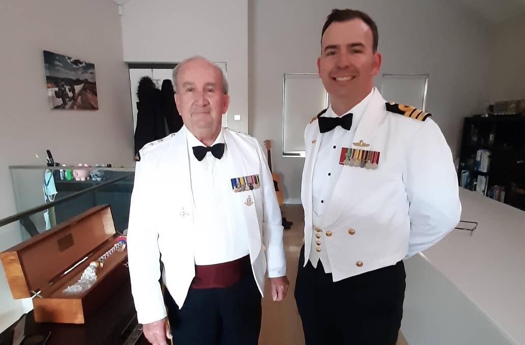 Prof Michael Hough and his son Commander Andrew Hough of the Royal Australian Navy in summer mess dress at the Royal Australian Armoured Corps Cambrai Day Dinner recently.
