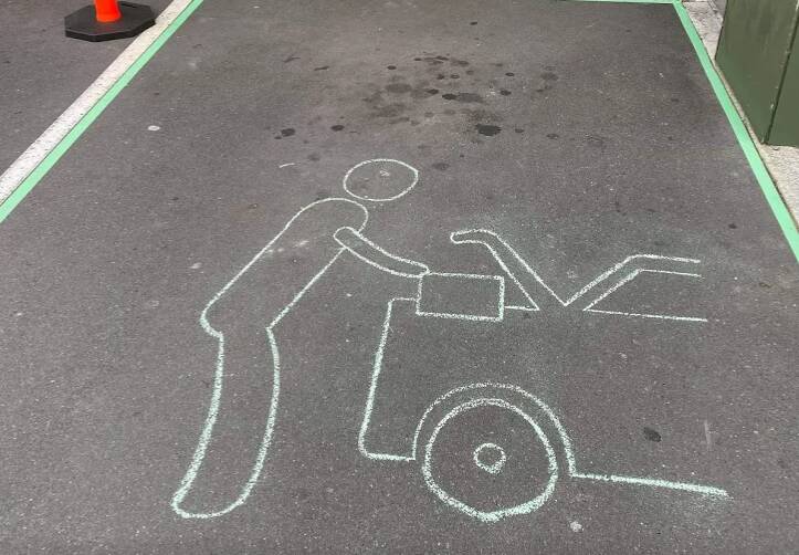 Simple idea: The chalk drawing at North Wollongong that Dan Murphy's is now painting on its direct-to-boot service parking bays around Australia.
