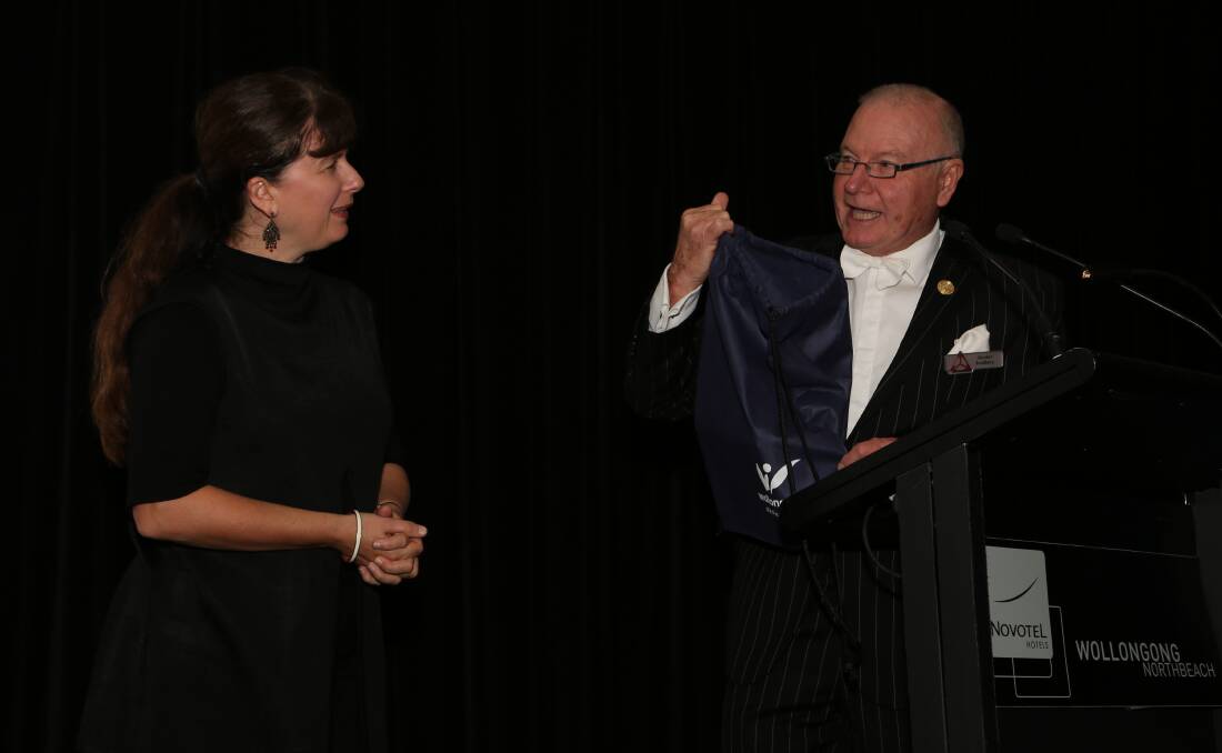 The gift: Wollongong Lord Mayor Gordon Bradbery hands over his gift to Tanya Phillips for her to present to the Lord Mayor of the host city in Italy. Picture: Greg Ellis.