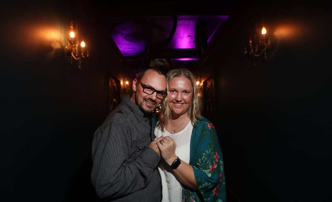 Romantic surprise: David and Glenda Hunter immediately after the re-proposal at Breakout Bar and Escape Rooms in Wollongong. Picture: Sylvia Liber.
