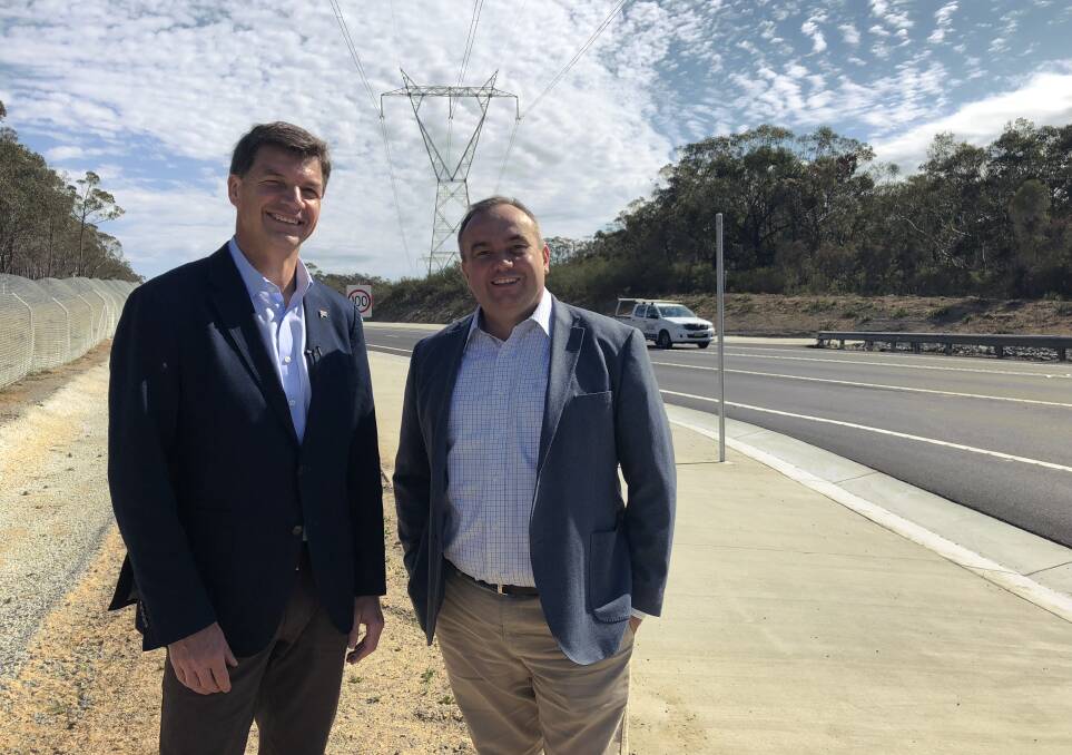 Road improvements: Angus Taylor and Jai Rowell at the new heavy vehicle acceleration lanes on Picton Road. 
