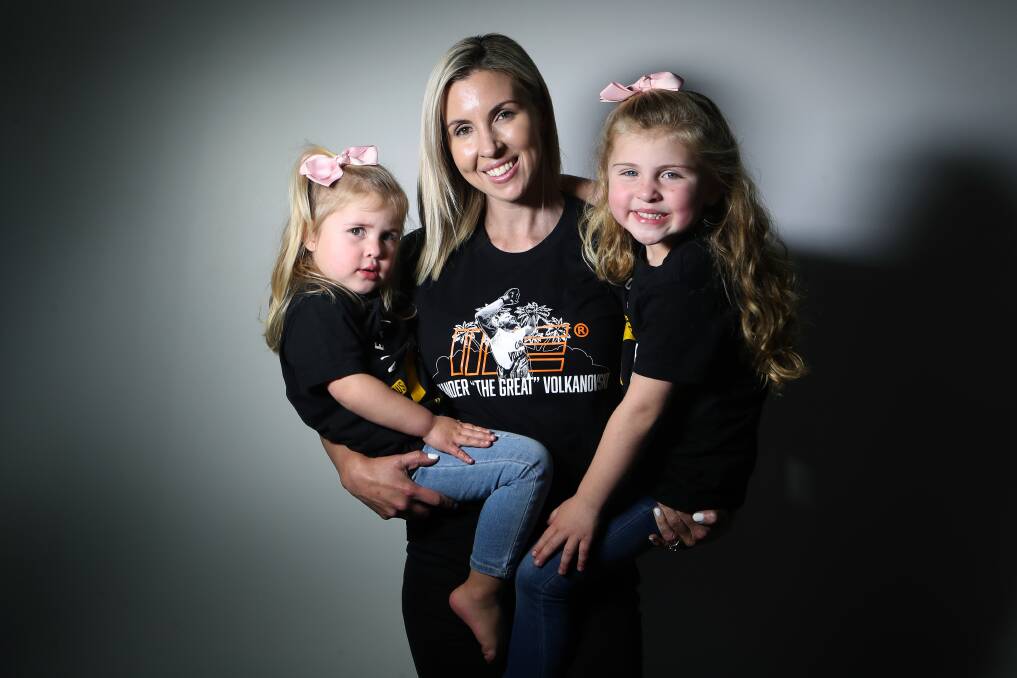 Cheering on from home: Emma Volkanovski with her daughters Airlie, 3, and Ariana, 5. Picture: Sylvia Liber.