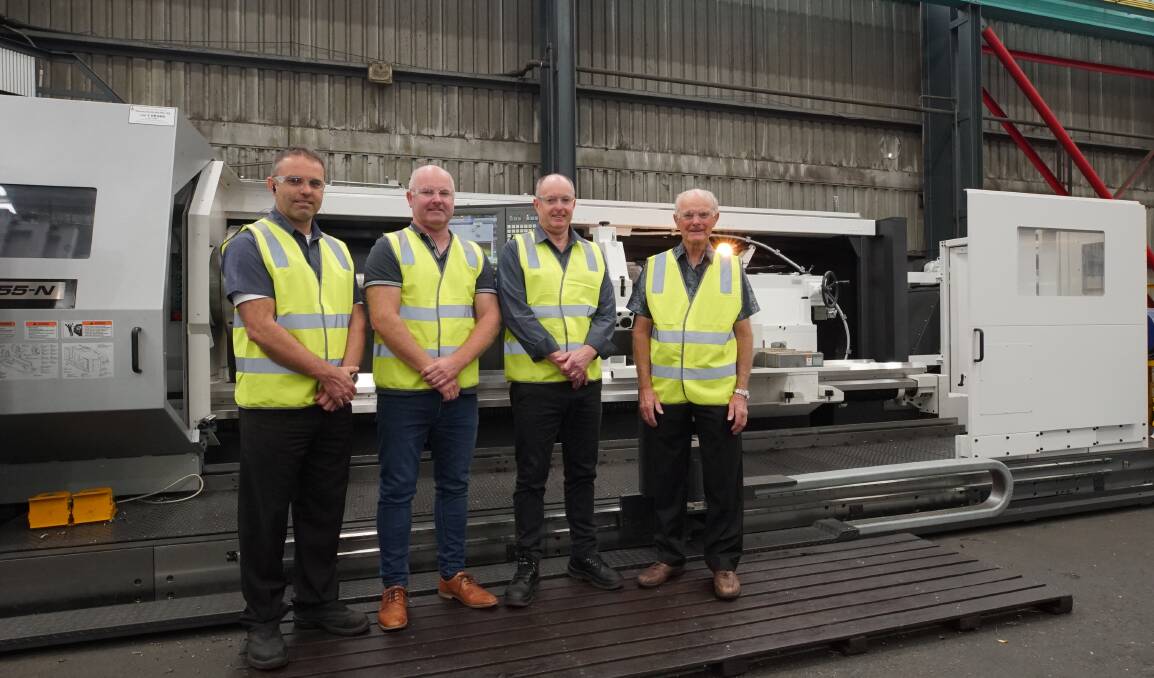 Growing capacity for heavy engineering: Jason, Kenley, Ray and Carel Leussink with the new state-of-the-art Okuma CNC Lathe at family run engineering firm Leussink in Unanderra.

