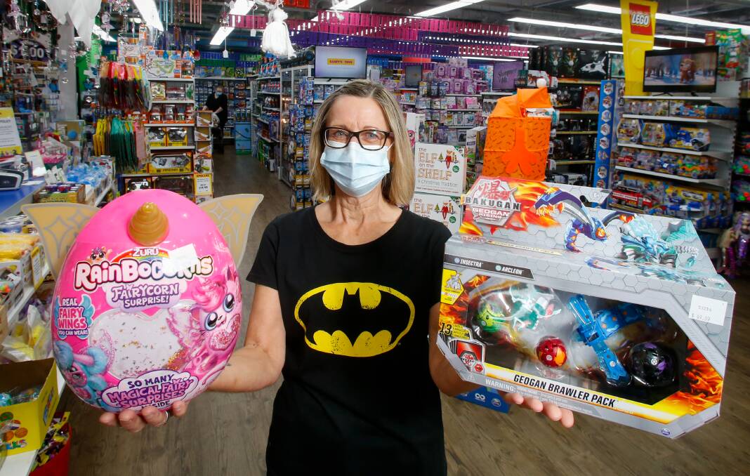 Christmas chaos: Casey's Toys acting manager Julieanne Mears with some of the early runners for the most populat toys this Christmas. Picture: Anna Warr.