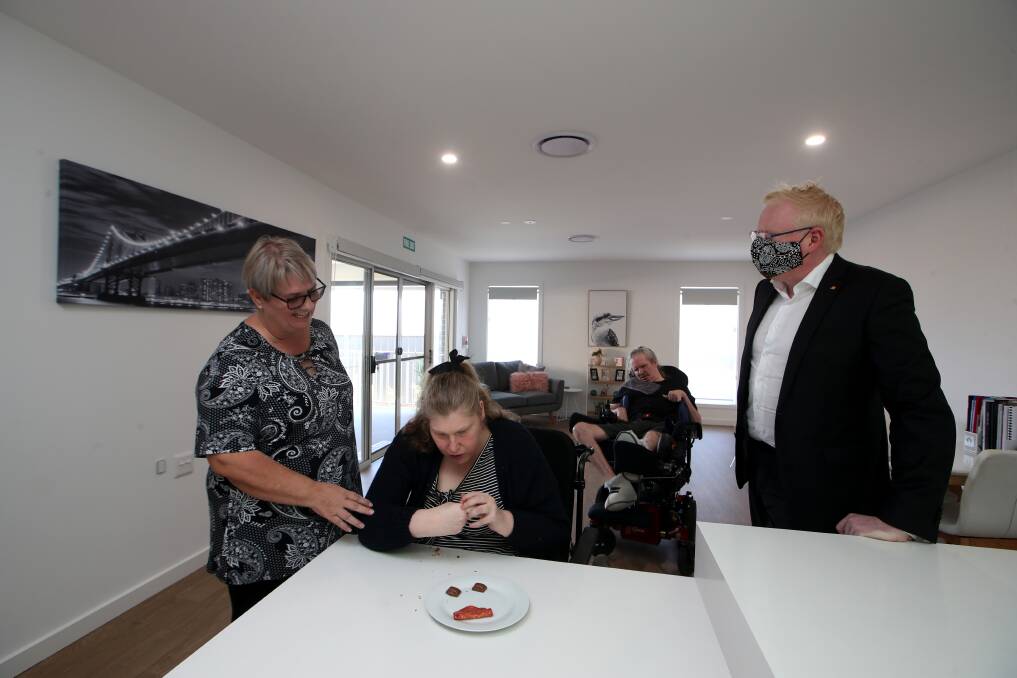 Better living: Disability Services minister Gareth Ward inspects Cram's newest Specialist Disability Accommodation house in Albion Park with Cram operations manager Linda Pollen and residents Lisa Dorahy and Dean Coleman. Picture: Sylvia Liber.