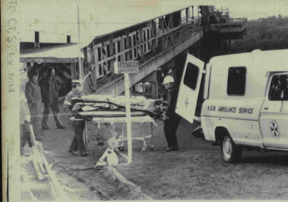 Tragic day: Ambulance officers with stretchers await the recovery of the 14 miners who died in an underground explosion at the Appin Colliery on July 25, 1979.

