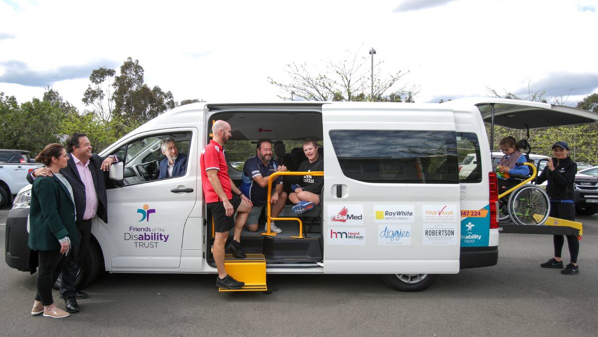 New Wheels: Tracy Stephenson, Daniel Norris, Edward Birt, Mick Baines and Michael Norris with Max and Ashlyn and carer Georgia Simpson unveil the new bus with a wheelchair lift. Picture: Adam McLean.
