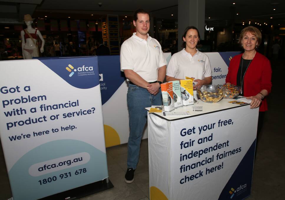 Financial complaints advice: Sam Kreitals, Clare Nightingale and Kathy Bowlen at the AFCA stand in Wollongong Central on Tuesday. Picture: Greg Ellis. 